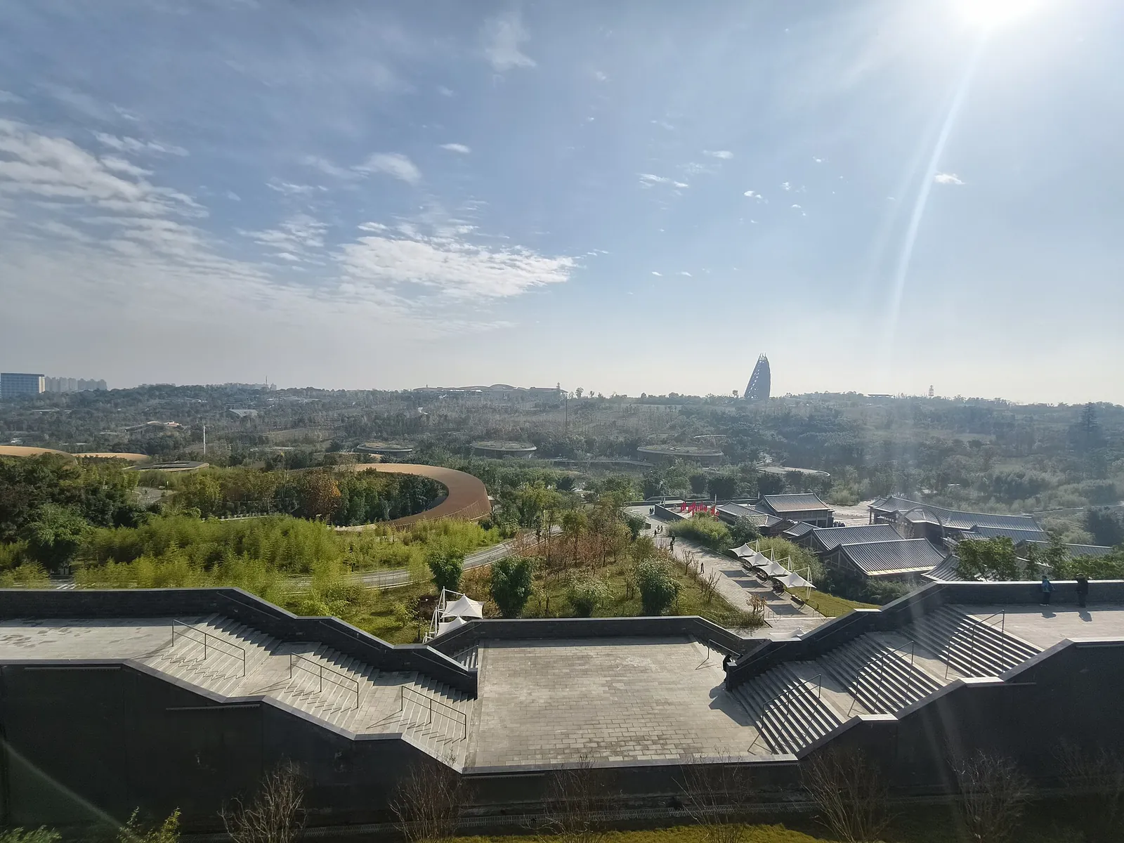 View across the green, hilly grounds of the Chengdu Panda Base